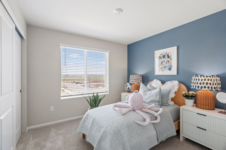 Representative furnished interior of a home built from the 2403 by Risewell Homes in Harvest Crossing, Aurora (Image 8).