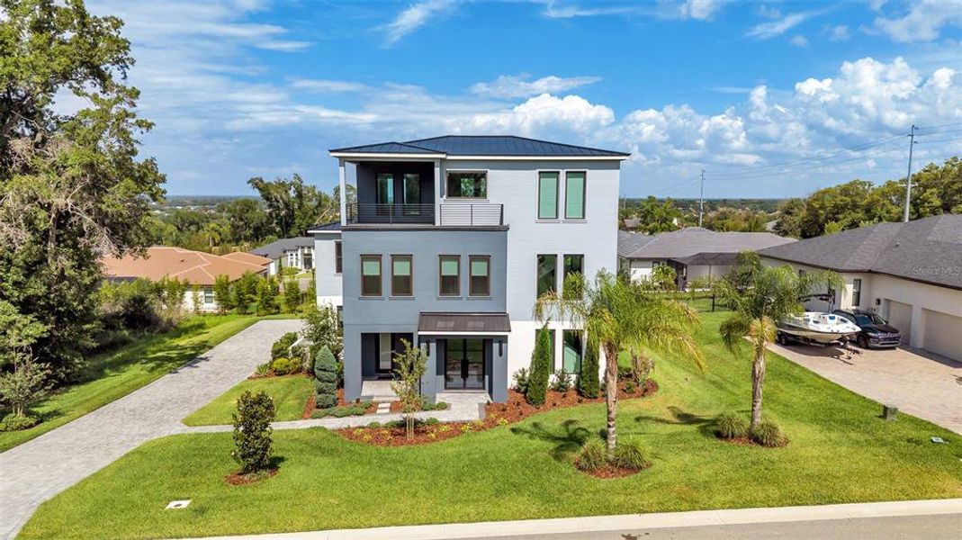 Front exterior of a new home in , Lakeland, FL, highlighting curb appeal (Image 27).