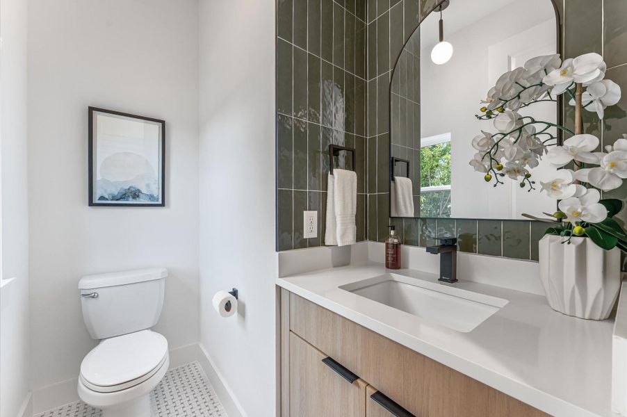 Designer-finished raised half bath for a refined guest experience Designer-finished raised half bath for a refined guest experience