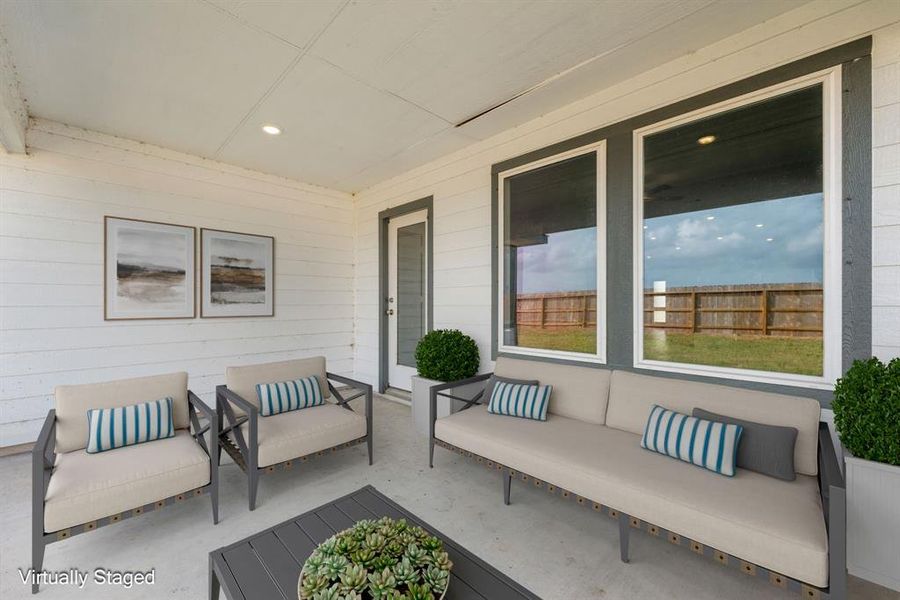 This covered patio is the perfect outdoor retreat, offering shade and comfort year-round. Ideal for relaxing or entertaining, it provides plenty of space for dining and lounging.