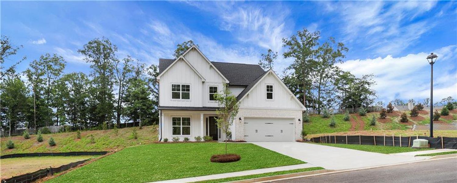Front exterior of a new home in Arbor West, Dawsonville, GA, highlighting curb appeal (Image 27).