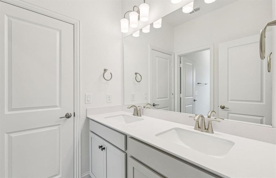 Elegant secondary bath with contemporary design  *Real home pictured