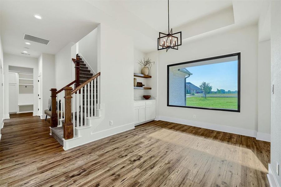 Dining Space with built in cabinets and floating shelves