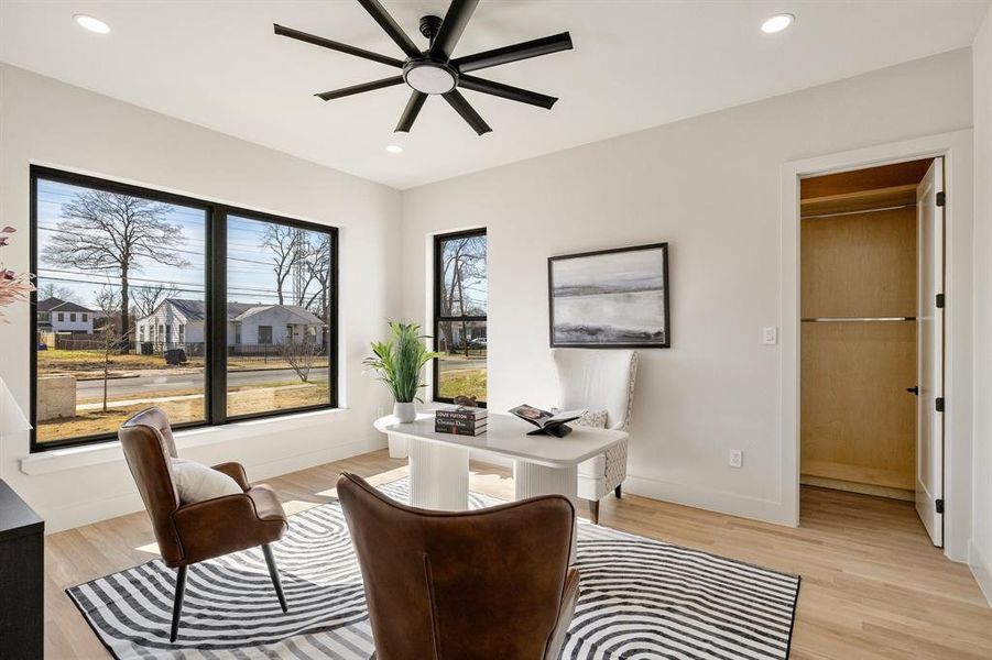 Office area featuring ceiling fan and light hardwood / wood-style flooring