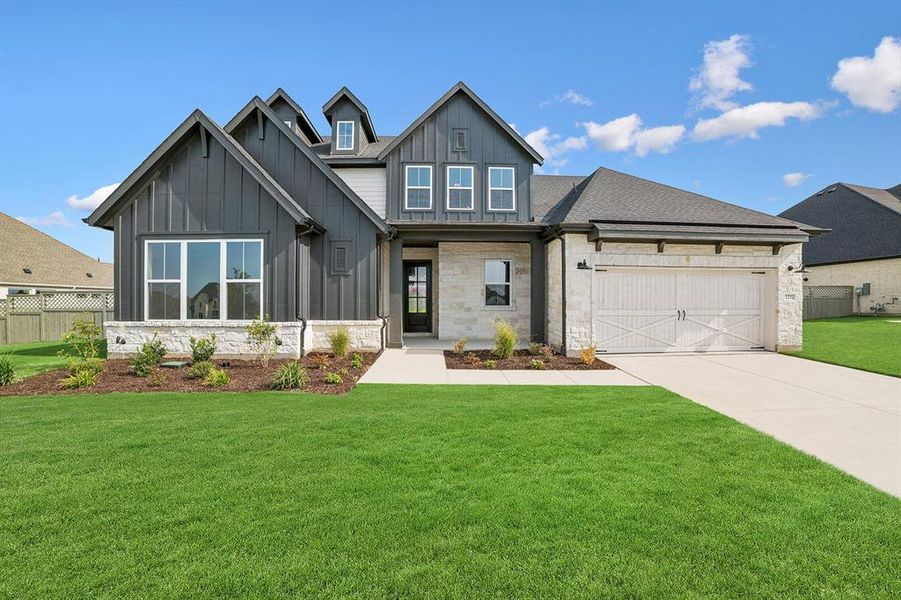Front exterior of a new home in Pecan Square - Estates, Northlake, TX, highlighting curb appeal (Image 1). Front exterior of a new home in Pecan Square - Estates, Northlake, TX, highlighting curb appeal (Image 1).