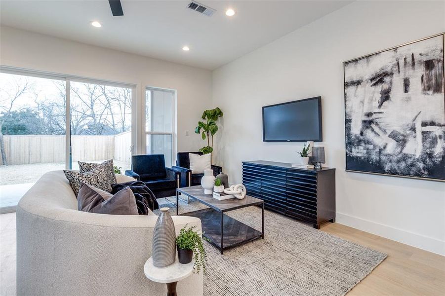 Living room with wood-type flooring