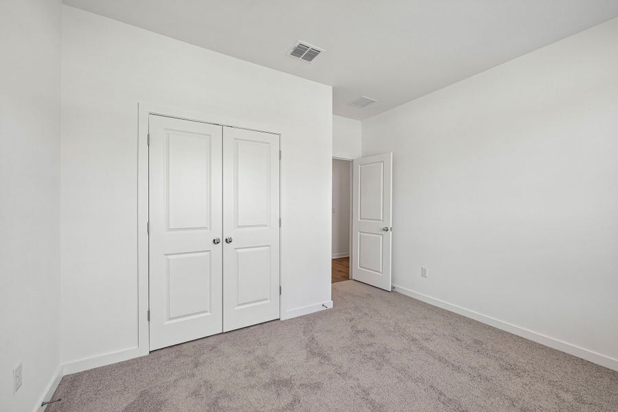 Representative unfurnished interior of a home built from the 3501 by Risewell Homes in Parkton Square, Kyle (Image 17).
