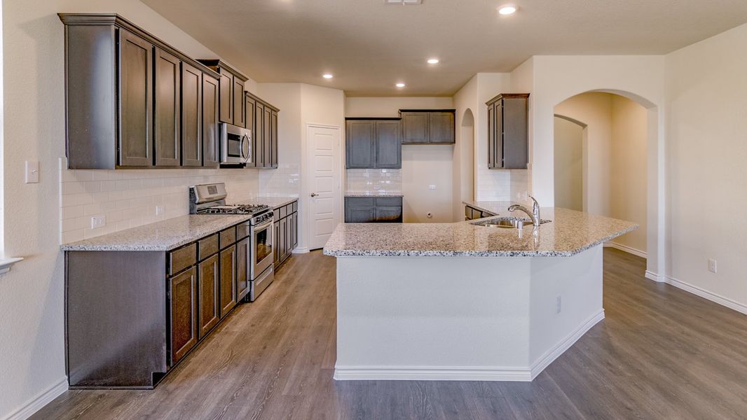 Representative furnished interior of a home built from the Daventry by D.R. Horton in Woodcreek, Fate (Image 2).
