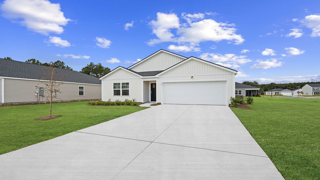 Front exterior of a new home in The Groves at Bees Creek, Ridgeland, SC, highlighting curb appeal (Image 2).