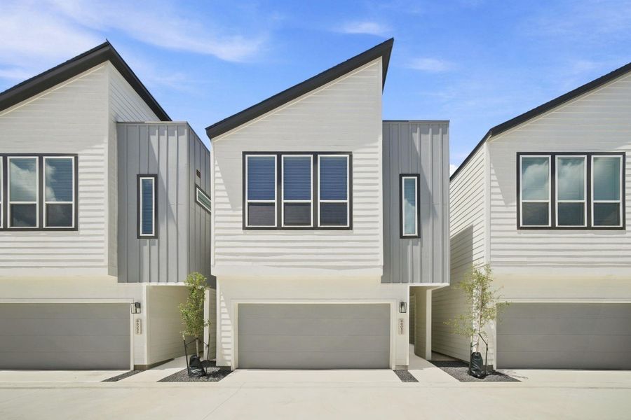 Modern two-story design featuring clean architectural lines, contemporary finishes, and an attached two-car garage. Modern two-story design featuring clean architectural lines, contemporary finishes, and an attached two-car garage.