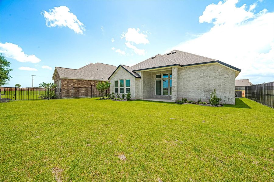 Front exterior of a new home in Lago Mar, La Marque, TX, highlighting curb appeal (Image 23).