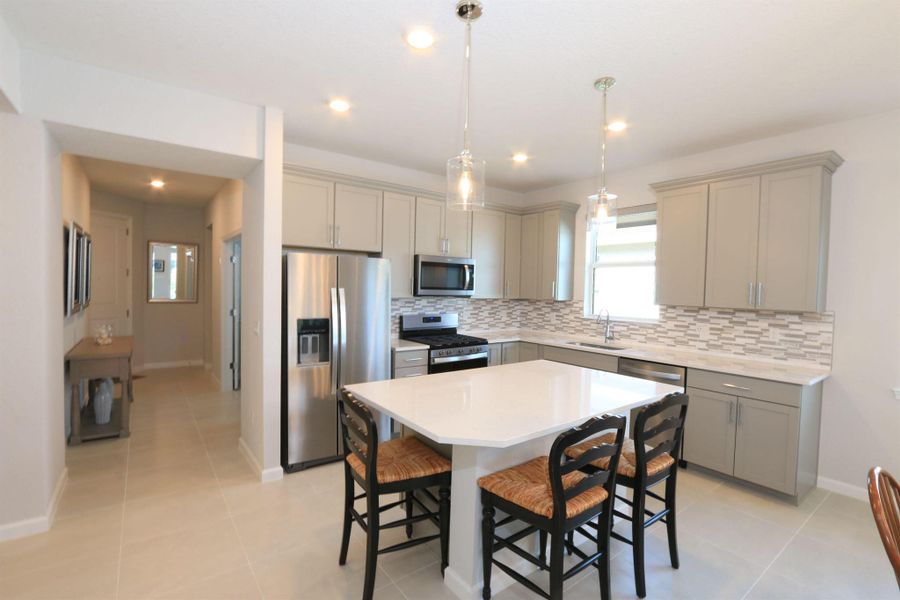 Furnished interior view inside a new home in Del Webb Tradition, Port St. Lucie (Image 31).