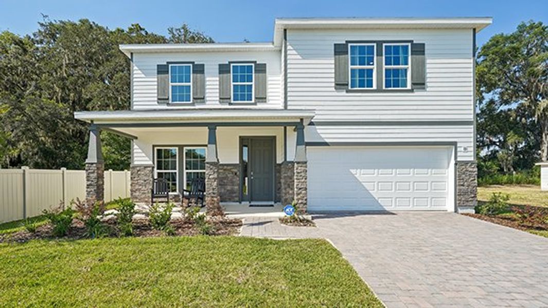 Representative exterior photo of a completed home built from the HOLDEN by D.R. Horton in Buchanan Trails, Newberry, FL (Image 1).