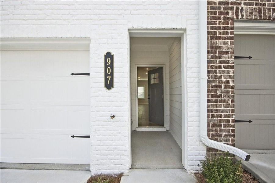 Front exterior of a new home in River Walk Place, Lawrenceville, GA, highlighting curb appeal (Image 17).