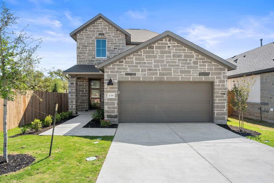 Front exterior of a new home in Heritage, Dripping Springs, TX, highlighting curb appeal (Image 22).