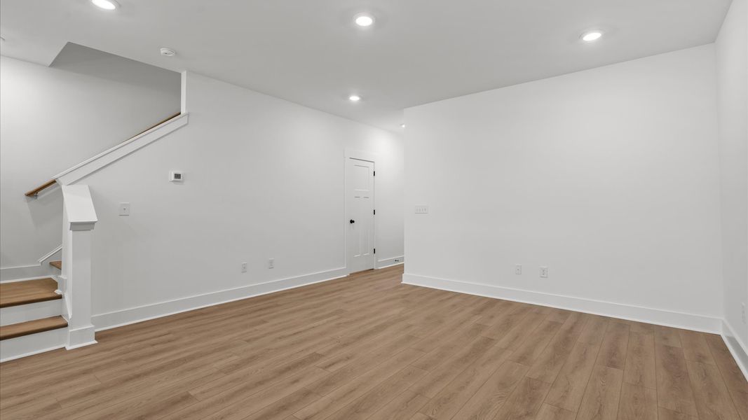 Exceptional family room with hardwood flooring in this exclusive Greenville-area townhome