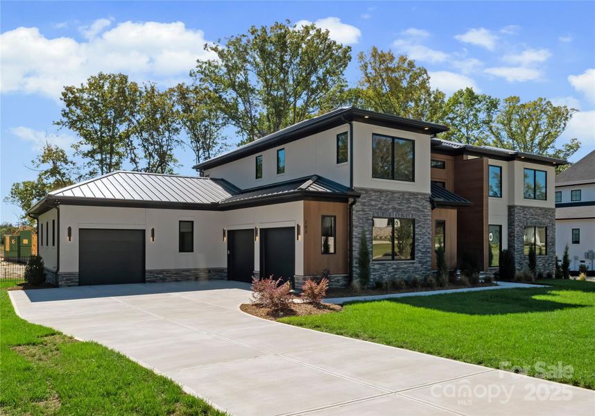 Front exterior of a new home in , Matthews, NC, highlighting curb appeal (Image 22).