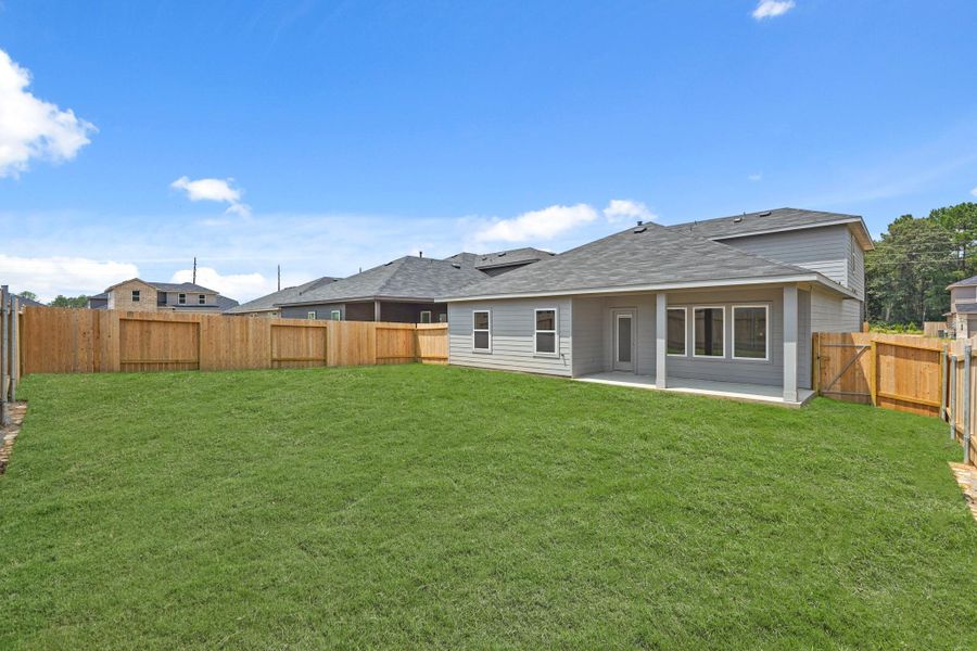 Exterior details and patio area of a home in Grand Pines, Magnolia (Image 2).