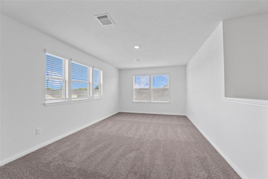 Head upstairs and enjoy the Loft—an additional living area perfect for a game room, media space, or a peaceful retreat. It features plush carpeting and large windows with privacy blinds! Head upstairs and enjoy the Loft—an additional living area perfect for a game room, media space, or a peaceful retreat. It features plush carpeting and large windows with privacy blinds!