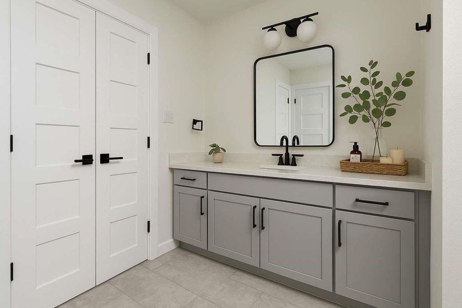 1st vanity and sink with storage in the primary, ensuite bathroom.