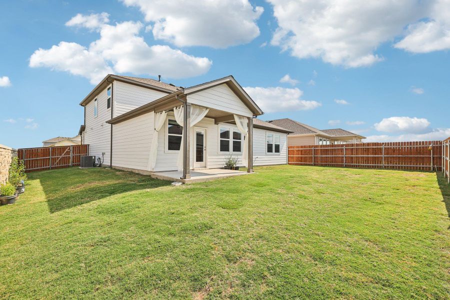 Front exterior of a new home in Emory Crossing 50s, Hutto, TX, highlighting curb appeal (Image 2). Front exterior of a new home in Emory Crossing 50s, Hutto, TX, highlighting curb appeal (Image 2).