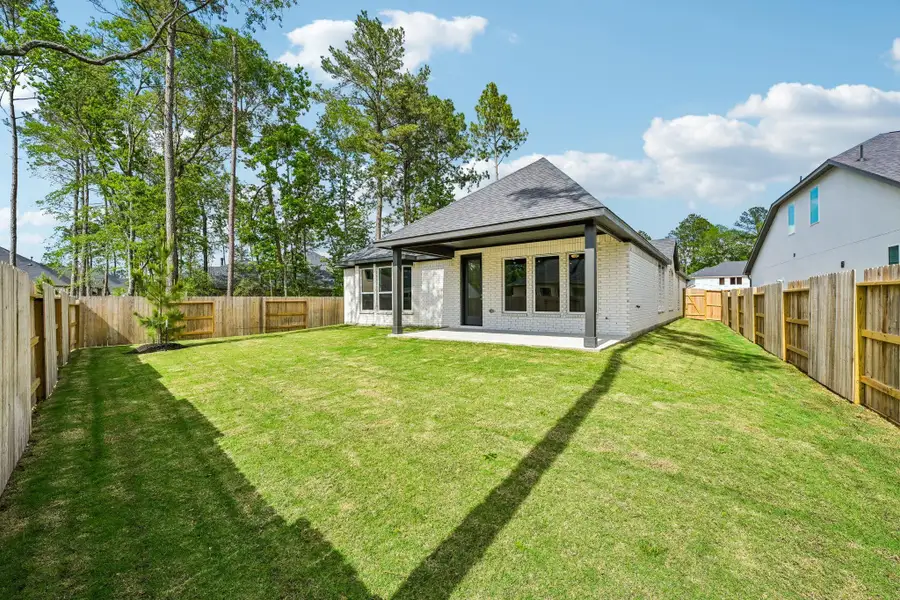Exterior details and patio area of a home in , Magnolia (Image 3).