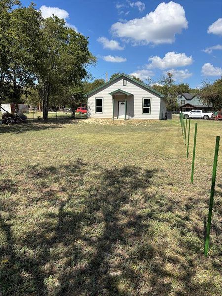 View of back facade with yard View of back facade with yard