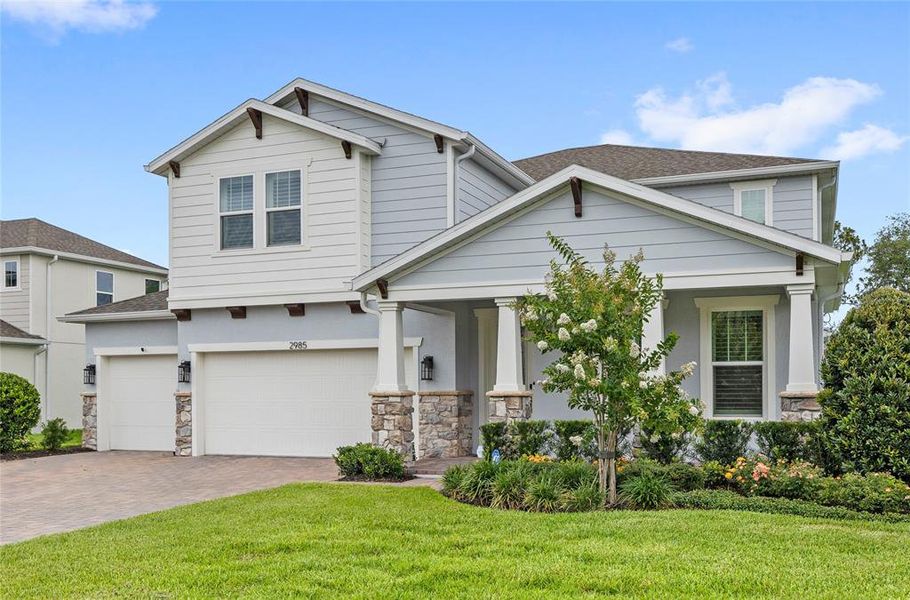 Front exterior of a new home in Acuera Estates, Apopka, FL, highlighting curb appeal (Image 33). Front exterior of a new home in Acuera Estates, Apopka, FL, highlighting curb appeal (Image 33).