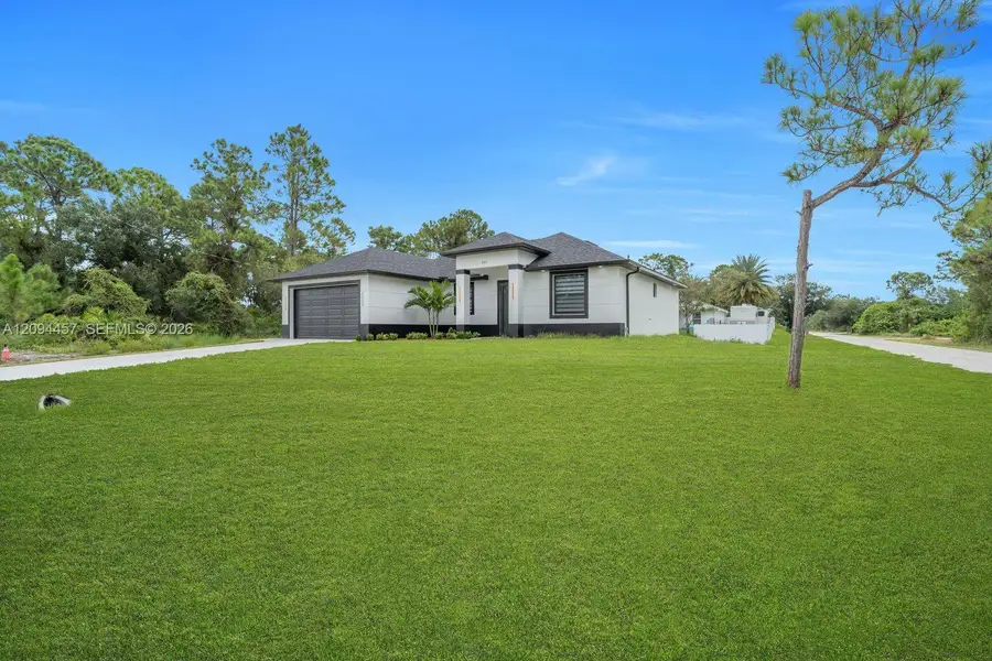 Front exterior of a new home in , Lehigh Acres, FL, highlighting curb appeal (Image 1). Front exterior of a new home in , Lehigh Acres, FL, highlighting curb appeal (Image 1).
