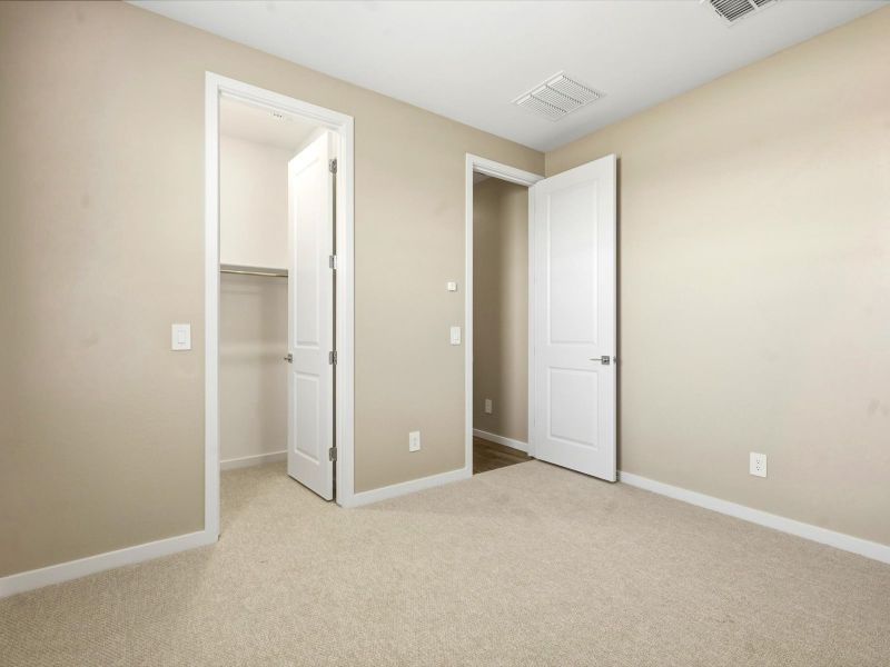 Spacious, unfurnished interior of a new home in White Tank Foothills Signature Series, Waddell (Image 18).