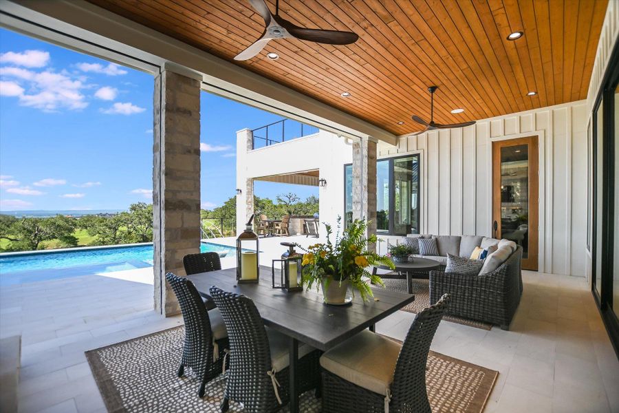 View of patio featuring a ceiling fan, an outdoor living space, an outdoor pool, and outdoor dining area View of patio featuring a ceiling fan, an outdoor living space, an outdoor pool, and outdoor dining area