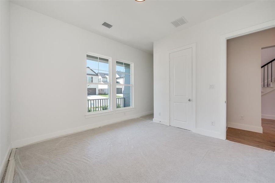 Unfurnished bedroom with hardwood / wood-style flooring