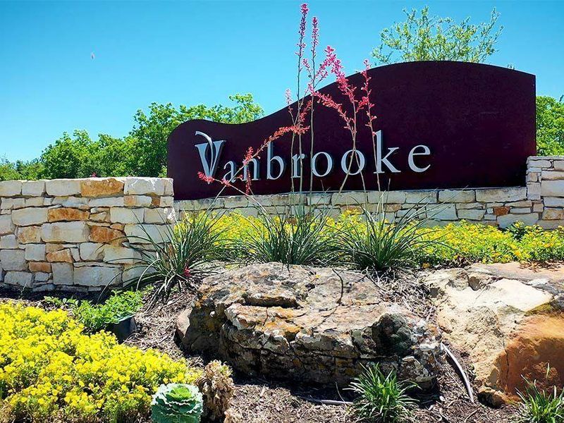 Front exterior of a new home in Vanbrooke, Brookshire, TX, highlighting curb appeal (Image 1).