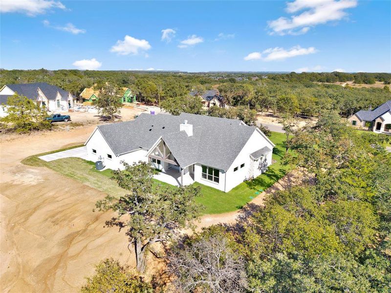 Front exterior of a new home in , Azle, TX, highlighting curb appeal (Image 24). Front exterior of a new home in , Azle, TX, highlighting curb appeal (Image 24).