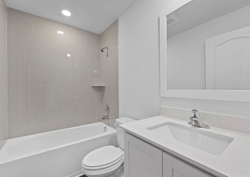 The guest bathroom has a spacious vanity, ready for your guests