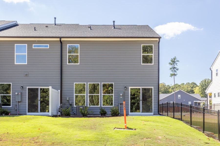 Exterior details and patio area of a home in Running Brook Townes, Durham (Image 2).