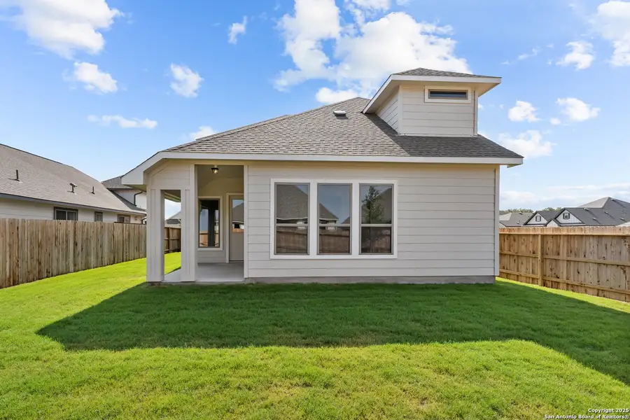 Front exterior of a new home in Megan's Landing, Castroville, TX, highlighting curb appeal (Image 10).