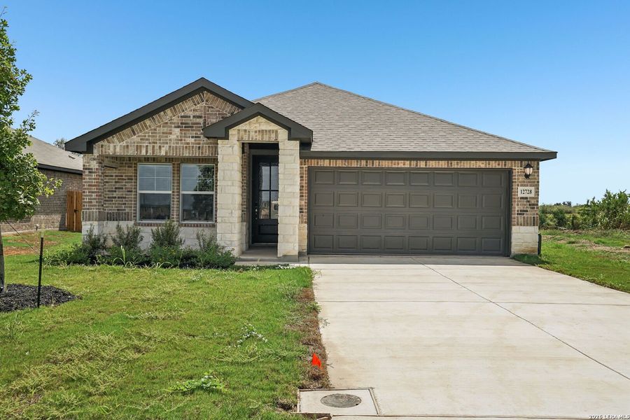 Front exterior of a new home in Carmel Ranch, Schertz, TX, highlighting curb appeal (Image 19). Front exterior of a new home in Carmel Ranch, Schertz, TX, highlighting curb appeal (Image 19).