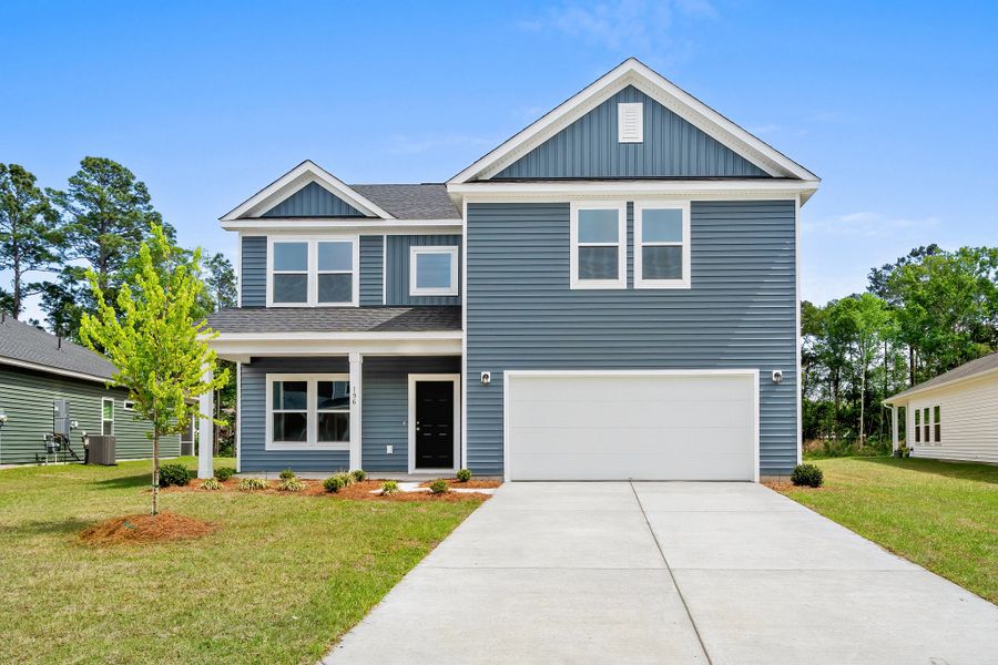 Front exterior of a new home in Trieste at Bella Vita, Myrtle Beach, SC, highlighting curb appeal (Image 1). Front exterior of a new home in Trieste at Bella Vita, Myrtle Beach, SC, highlighting curb appeal (Image 1).