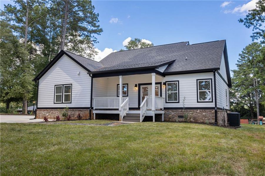 Front exterior of a new home in , Monroe, GA, highlighting curb appeal (Image 26). Front exterior of a new home in , Monroe, GA, highlighting curb appeal (Image 26).