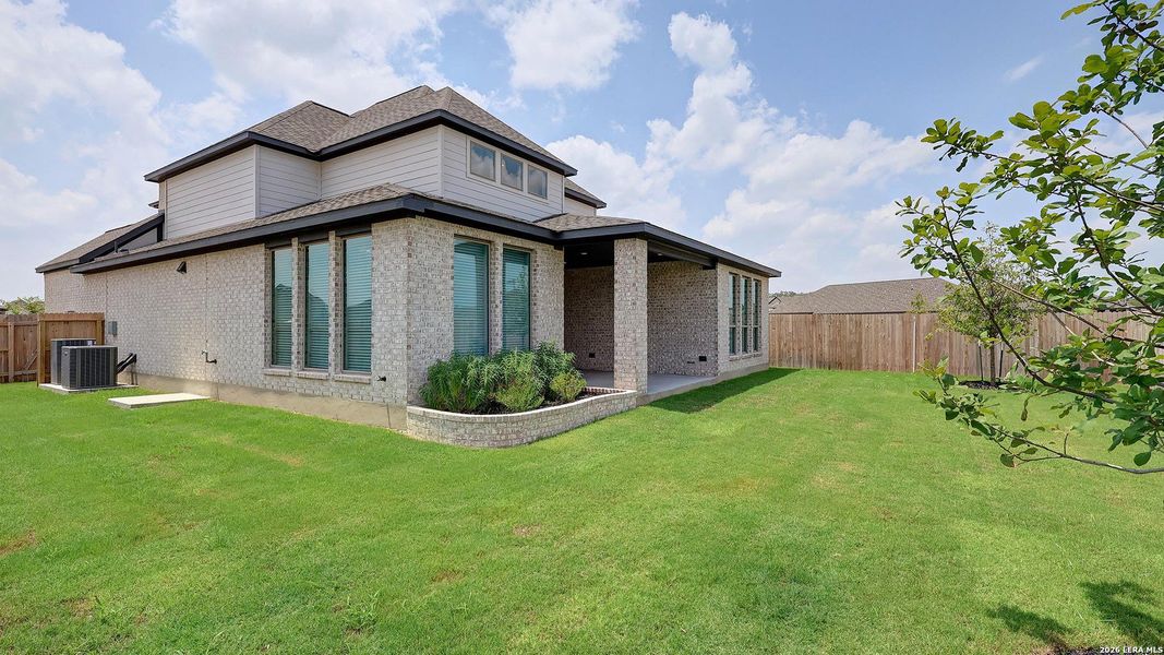 Exterior details and patio area of a home in Alsatian Oaks, Castroville (Image 4).