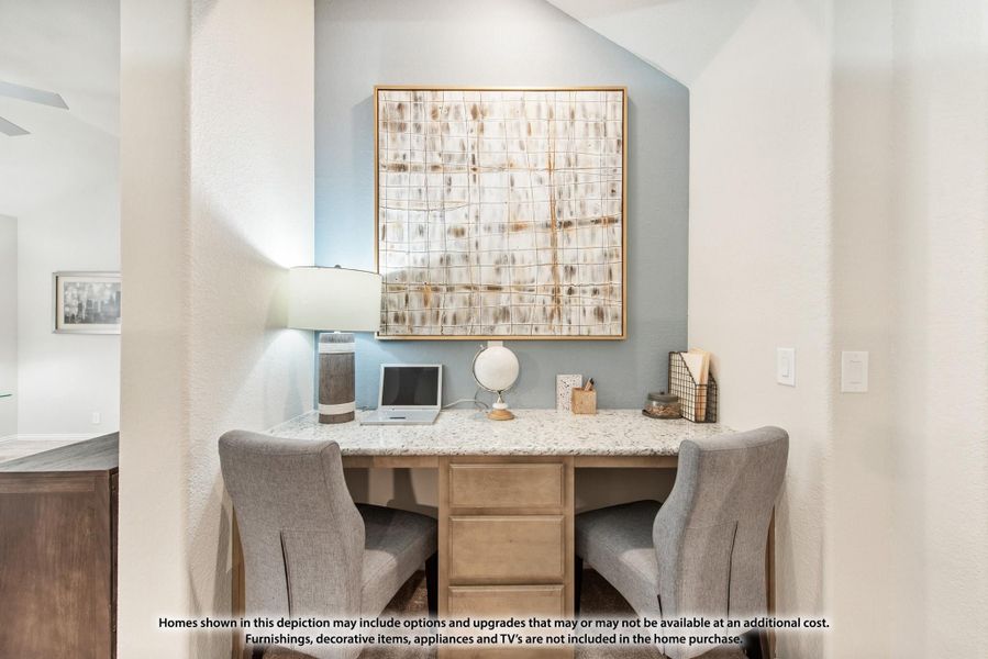Built-in home office nook with granite desk, two chairs, and wall art above Built-in home office nook with granite desk, two chairs, and wall art above