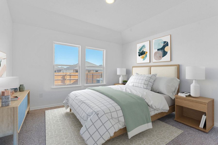 Carpeted bedroom featuring baseboards