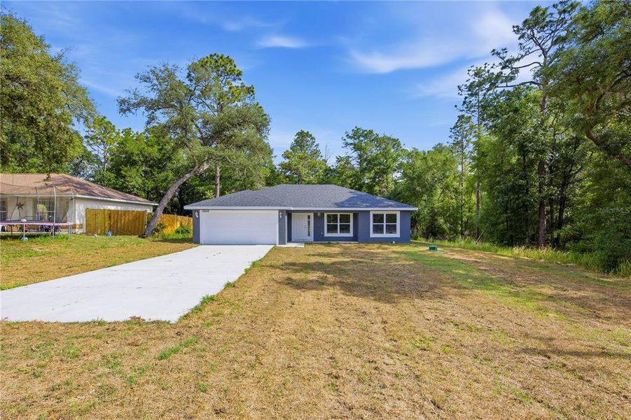 Front exterior of a new home in , Ocala, FL, highlighting curb appeal (Image 2). Front exterior of a new home in , Ocala, FL, highlighting curb appeal (Image 2).