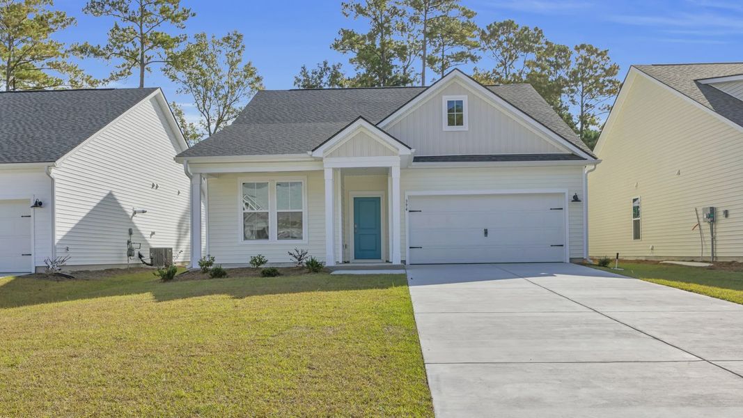 Representative exterior photo of a completed home built from the Chelsea by DRB Homes in Bluffs at Sun Colony, Longs, SC (Image 21).