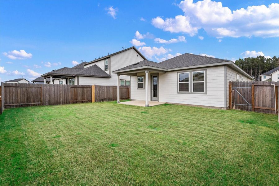 Exterior details and patio area of a home in Mason Woods, Cypress (Image 26).