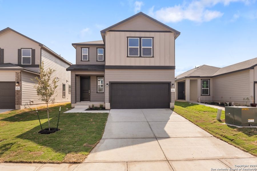 Front exterior of a new home in The Granary - Heritage Collection, San Antonio, TX, highlighting curb appeal (Image 1). Front exterior of a new home in The Granary - Heritage Collection, San Antonio, TX, highlighting curb appeal (Image 1).