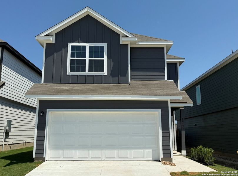 Front exterior of a new home in Melissa Ranch, San Antonio, TX, highlighting curb appeal (Image 20). Front exterior of a new home in Melissa Ranch, San Antonio, TX, highlighting curb appeal (Image 20).