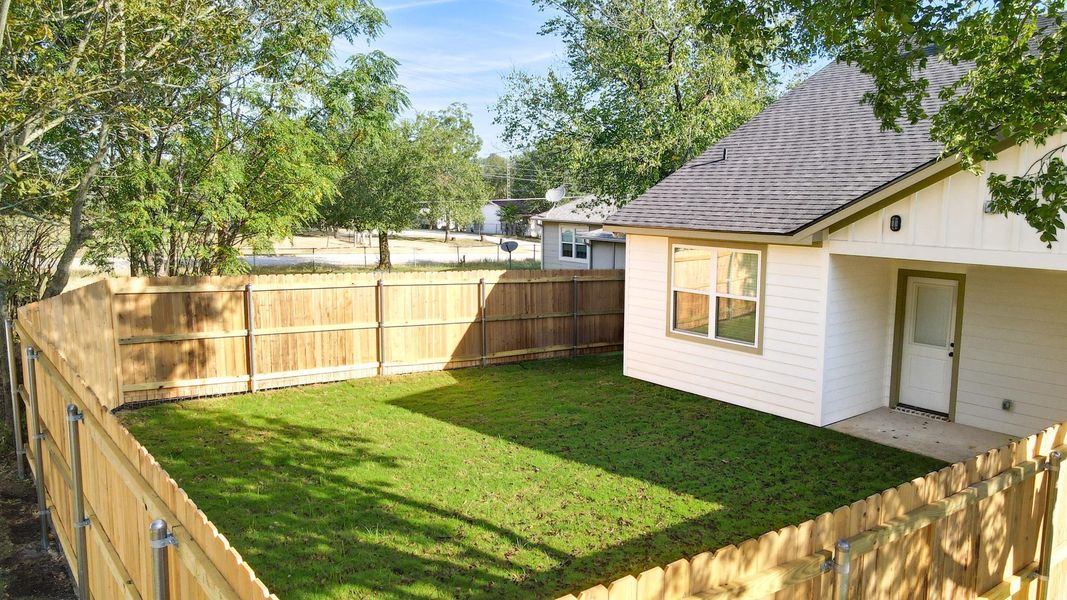 View of fenced backyard