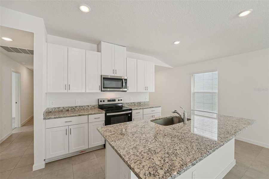 Furnished interior view inside a new home in Flagler Village - Classic Series, Palm Coast (Image 11).